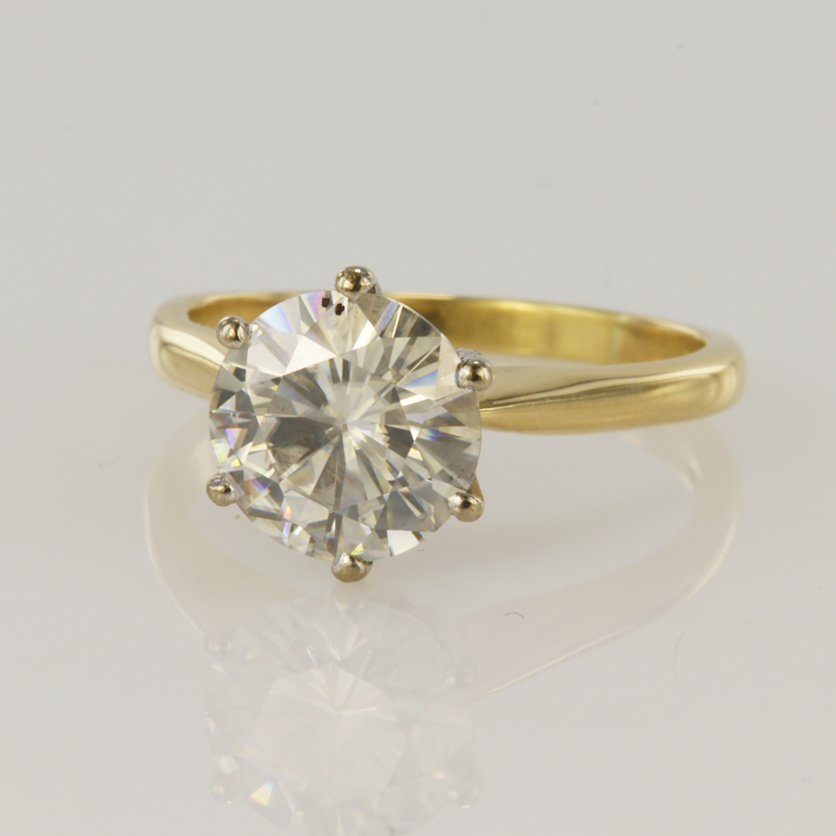 18ct yellow gold solitaire ring set with around brilliant cut 2.50ct Moissanite stone in a six