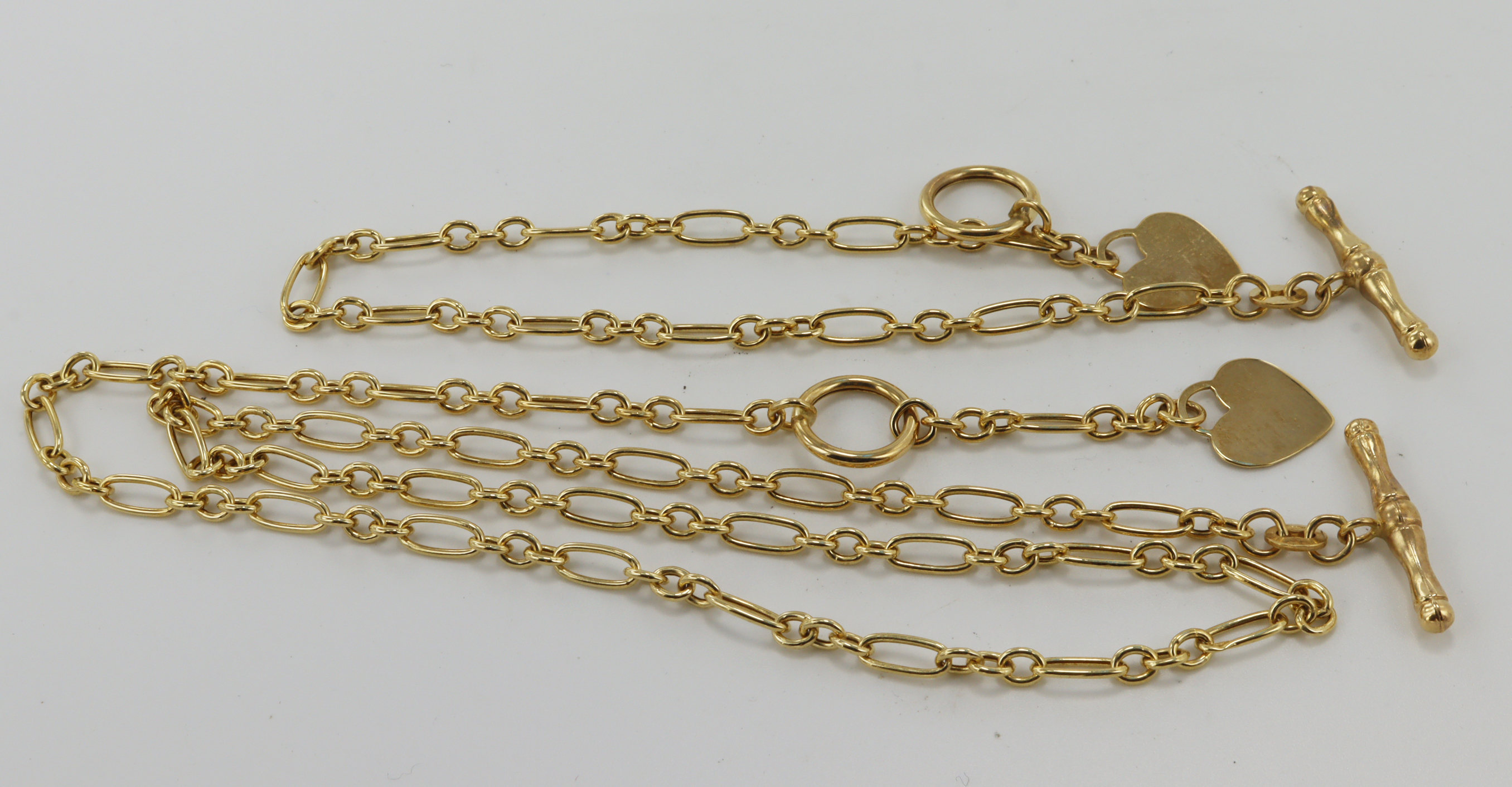 9ct yellow gold necklace and bracelet set, figraro links both with a heart charm and T-bar clasp