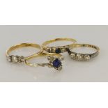 Four yellow gold (tests 18ct) rings, stones include diamond, sapphire, blue paste, finger sizes J,