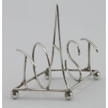 Hukin & Heath silver toast rack which reads "TOAST" in large silver letters, marked on the base with