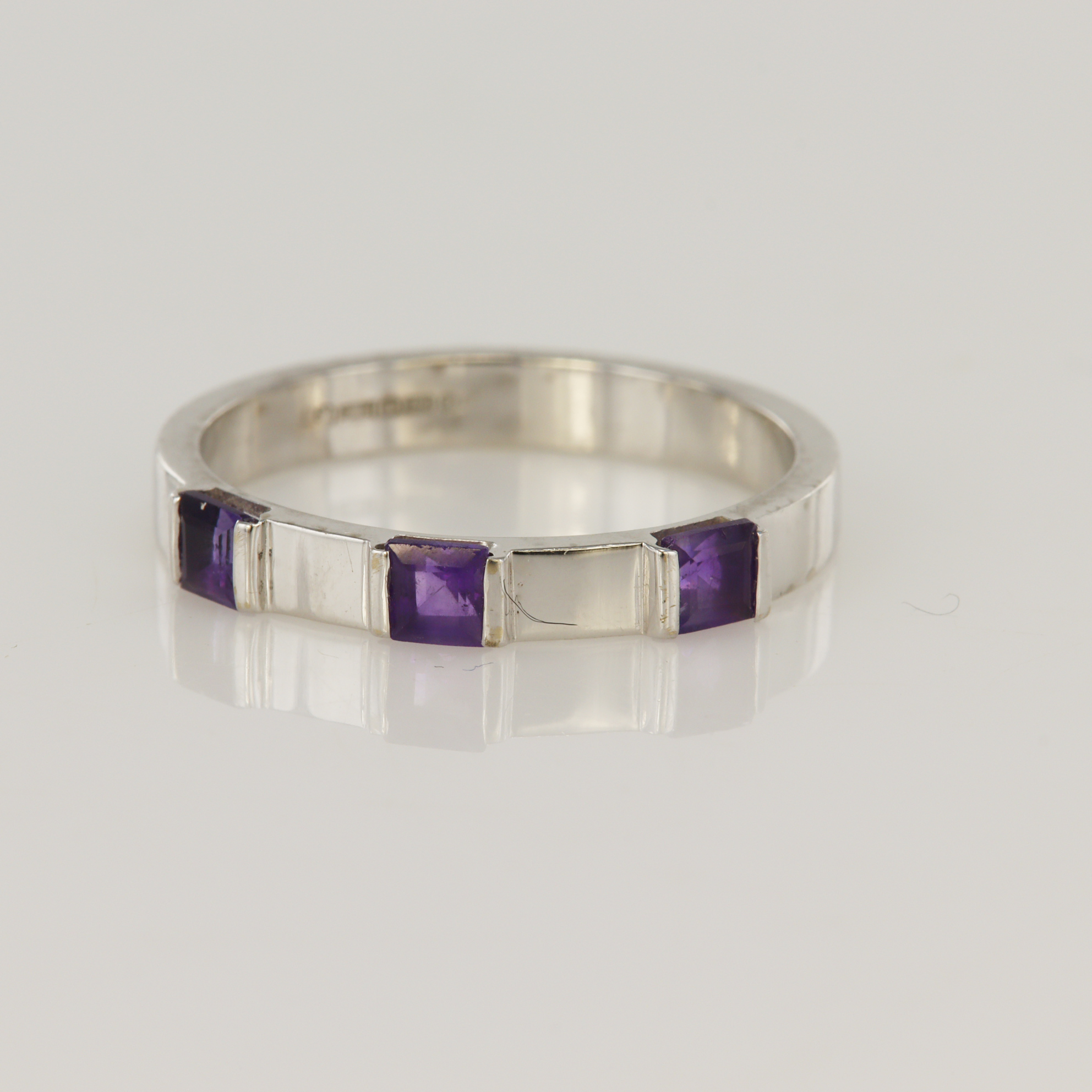 18ct white gold amethyst three stone ring, three sqaure cuts measuring approx. 3mm each, finger size