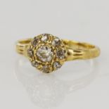 Yellow gold (tests 18ct) diamond cluster ring, principle old European cut approx. 0.20ct, surrounded