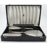 Boxed four piece silver mounted dressing table set comprising hand mirror, hairbrush, clothes