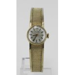 Ladies 9ct cased Tudor manual wind wristwatch, circa 1965. The silvered dial with baton markers