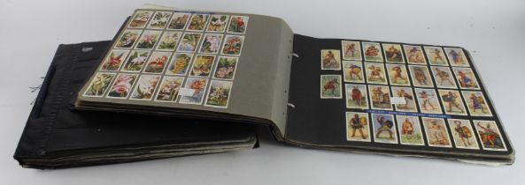 Collection of 42 complete sets contained in photo corners within 2 large albums, issuers include