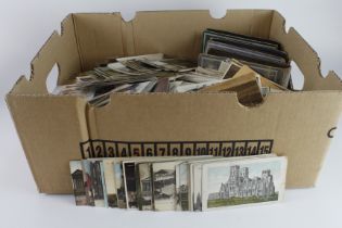 Banana box with 1000's of mixed loose old postcards incl RP's, plus 3x small old albums. Needs