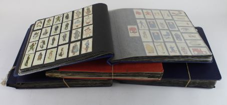 Collection of approx 58 complete sets & 24 part sets, contained in photo corners within   4 large
