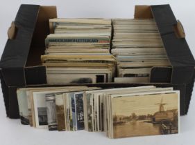 Small black banana box crammed with mixed old postcards (many 100's) Heavy