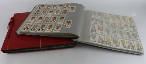 Collection of 34 complete sets & 1 part set contained in photo corners within 2 large albums,