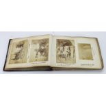Album. A Victorian album containing numerous black & white photographs and clippings, topics include