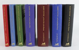 Rowling (J. K.). A set of seven Harry Potter 1st edition Deluxe volumes, comprising Harry Potter and