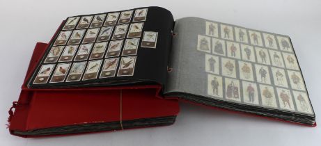 Collection of 43 complete sets contained in photo corners within 2 large albums, issuers include,