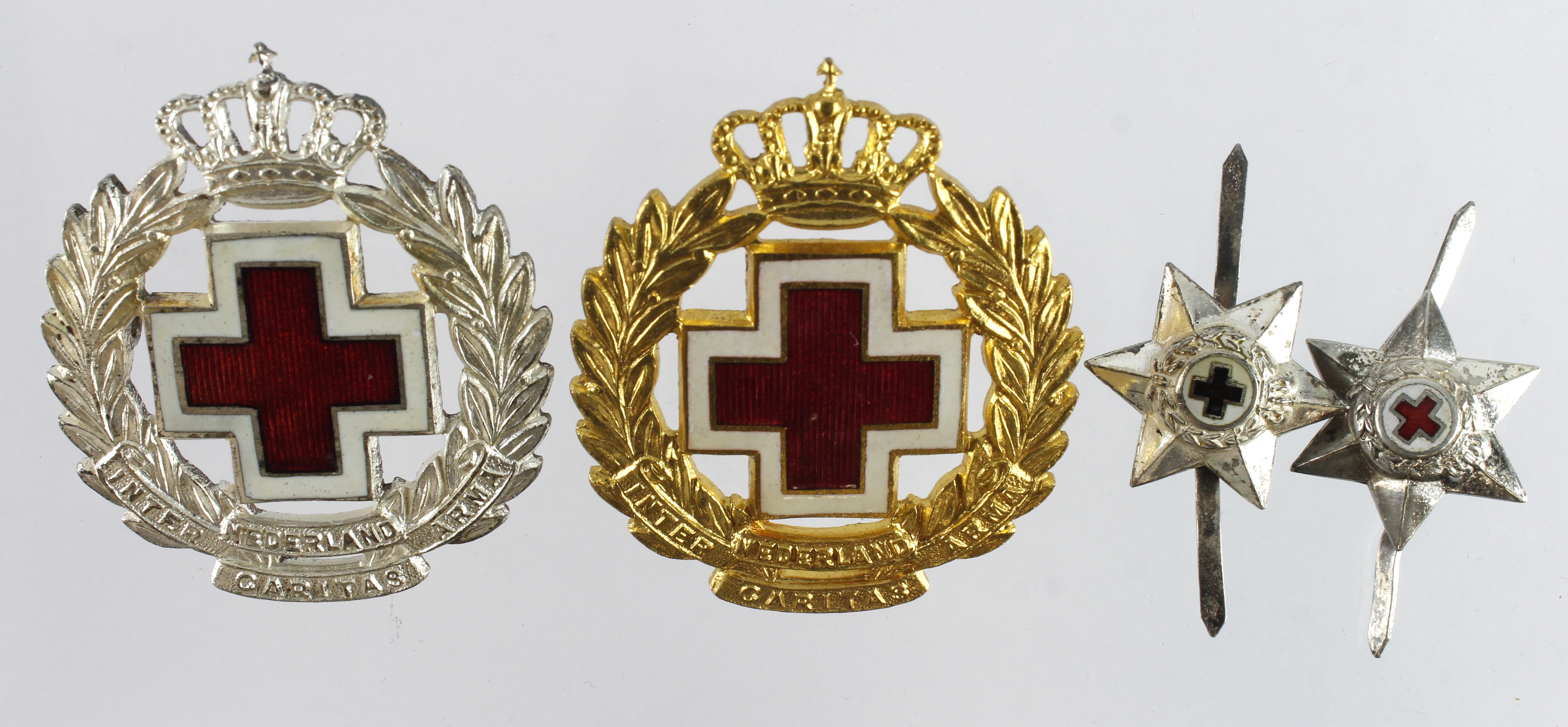 Dutch Red Cross Hat badges (2) gilt & silvered, plus 2 unmarked silver badges/stars.