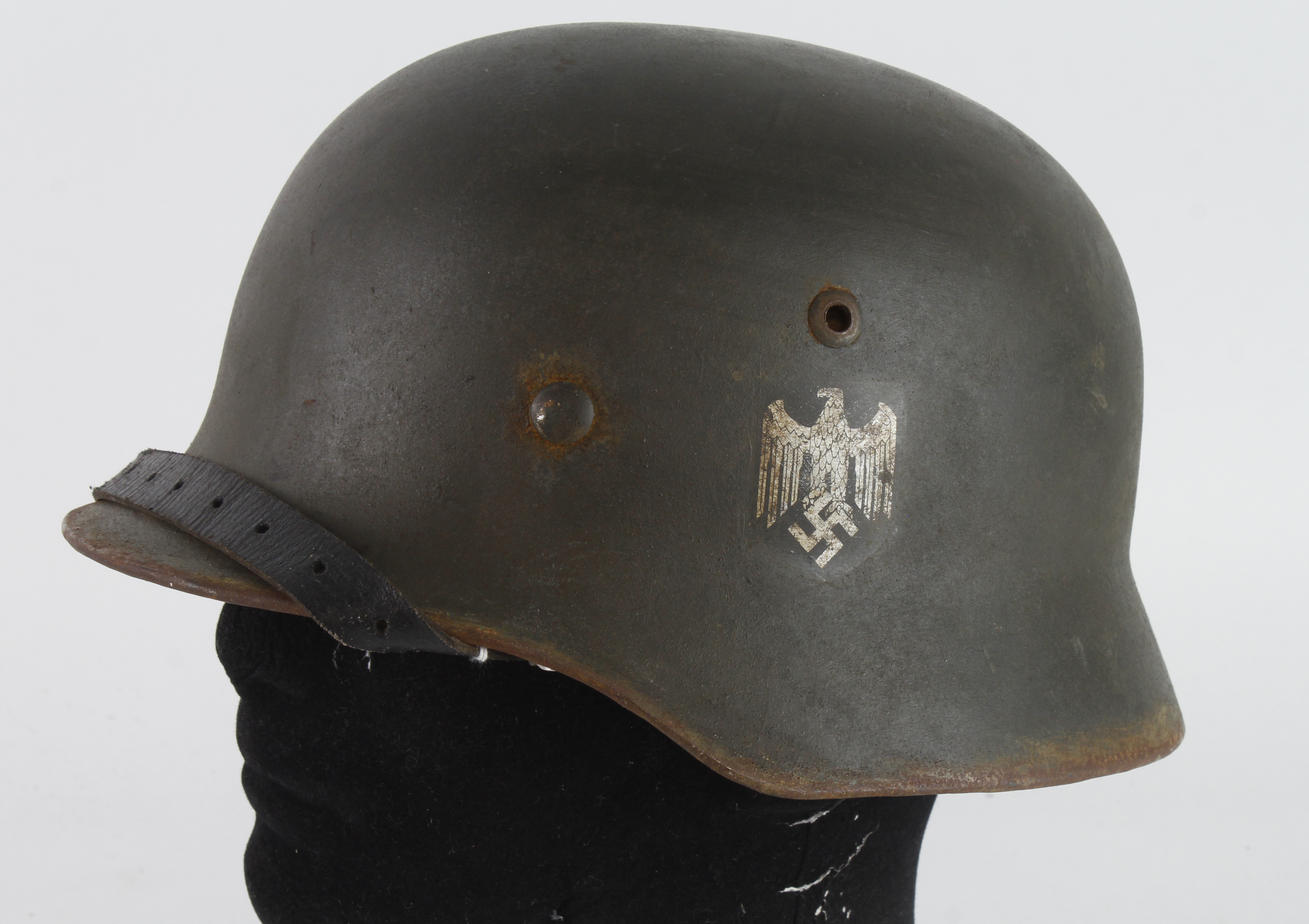 German Wehrmacht M35 double decal combat helmet, complete with liner and chin strap, ET64 to skirt.