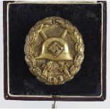 German from a one owner collection a Wounds badge for Spnish Civil War in gold, cased.