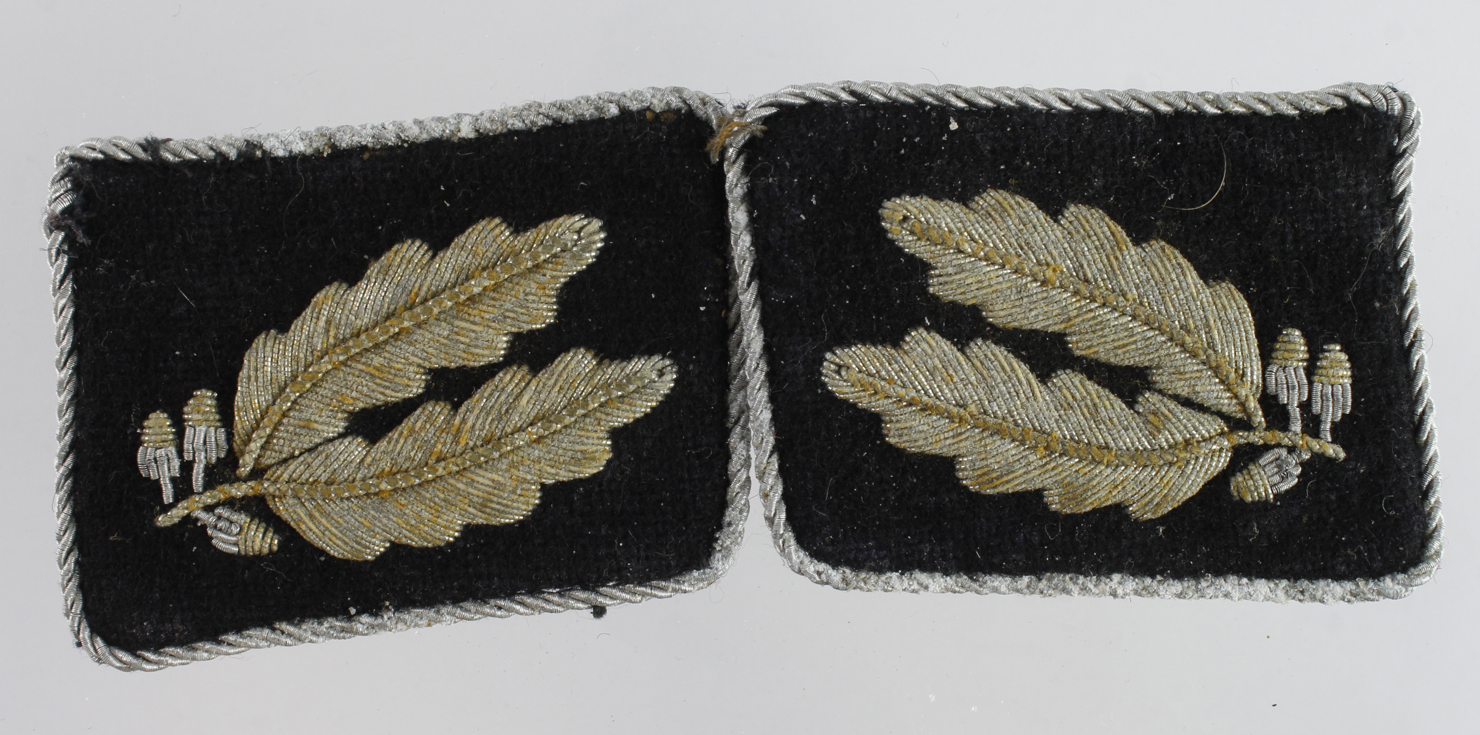 German SS OBERFUHRER pair of collar tabs with paper manufacturers paper labels on the back.