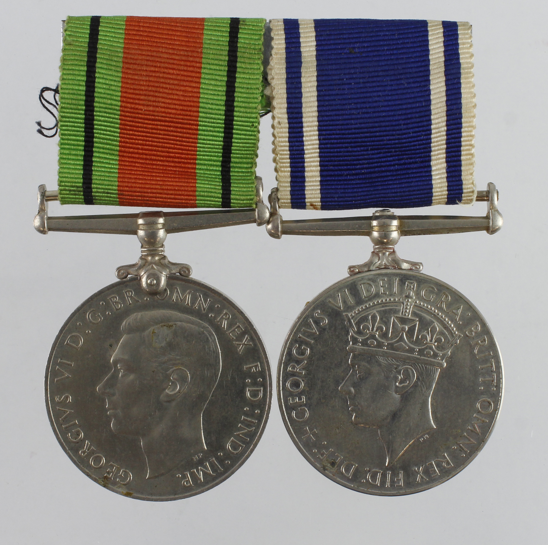 Police LSGC Medal GVI (Const Thomas E. Brailsford) and Defence Medal. Served Birmingham City Police.