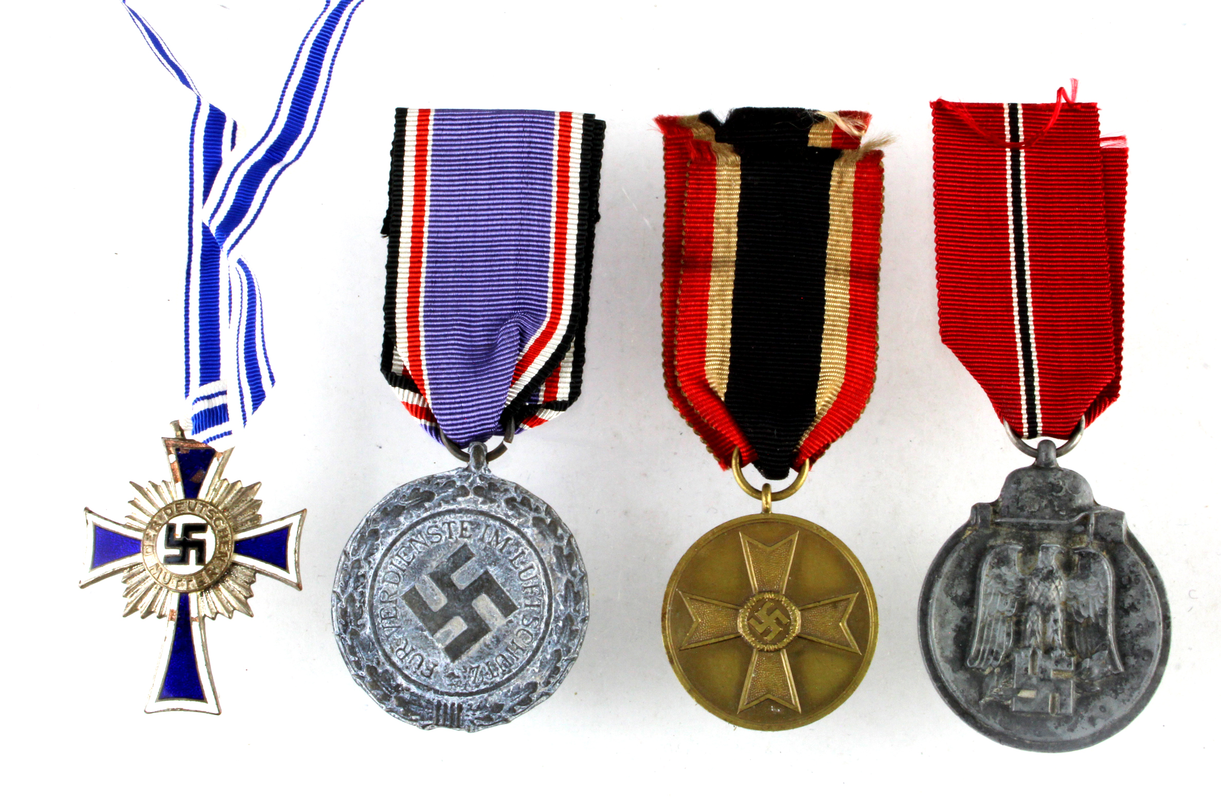 German WW2 medals including Russian Front, Luftscutz, Mothers Cross and War Merit medal.