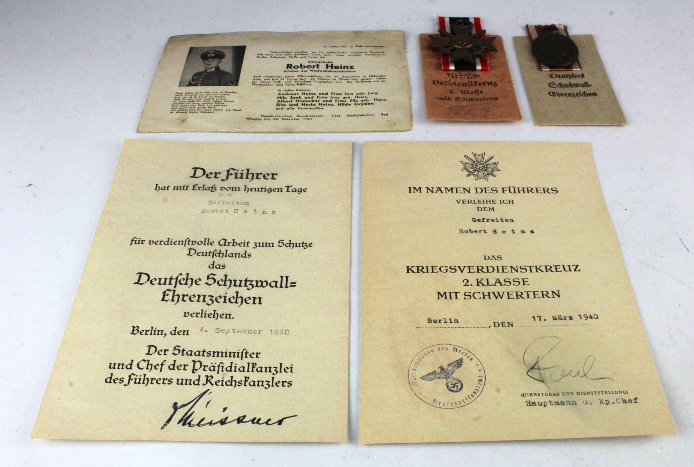 German WW2 war merit 2nd class with swords with award document and West Wall medal with award