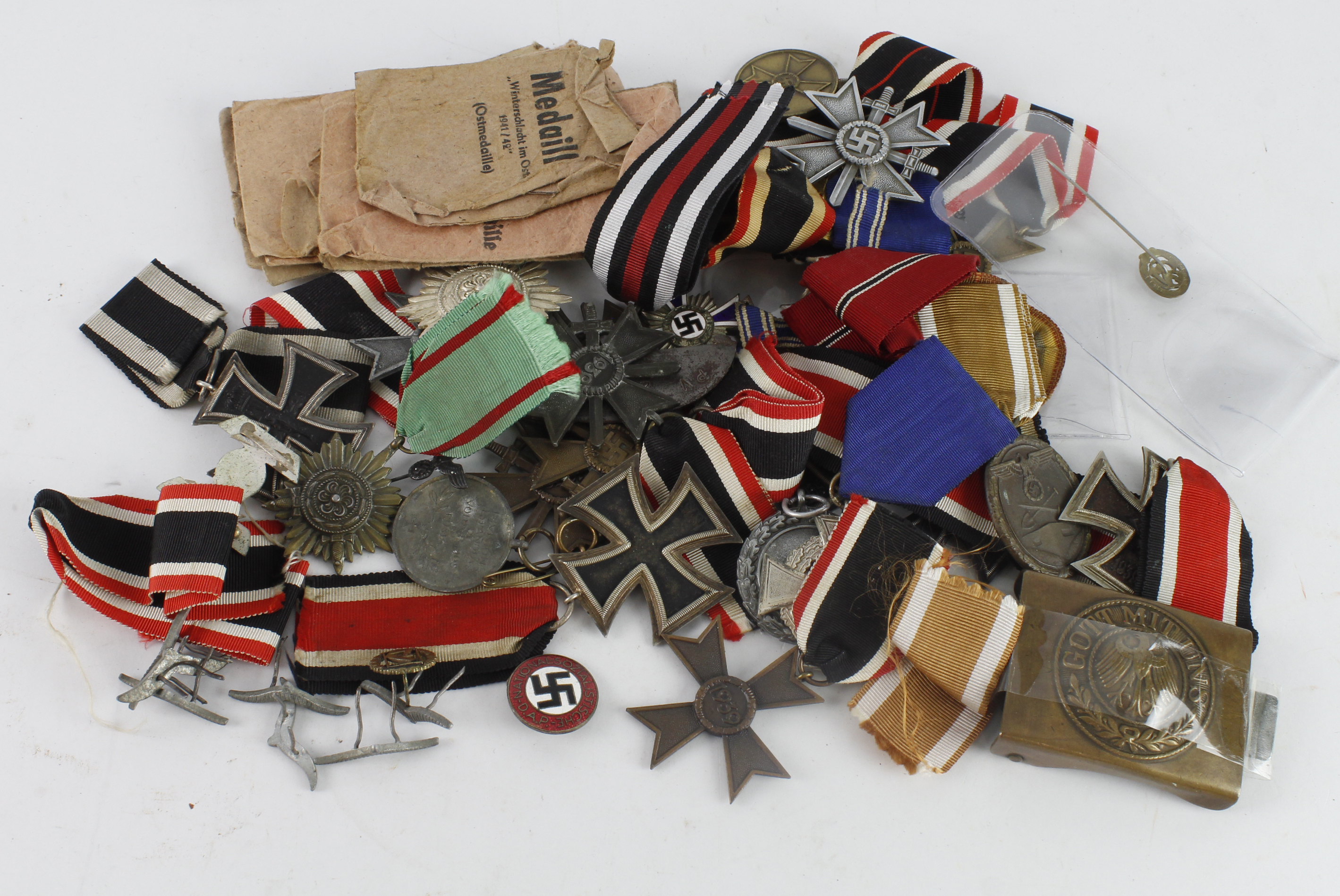 Collection of German 3rd Reich Orders, Medals and Decorations, plus some paper packets. Good lot,