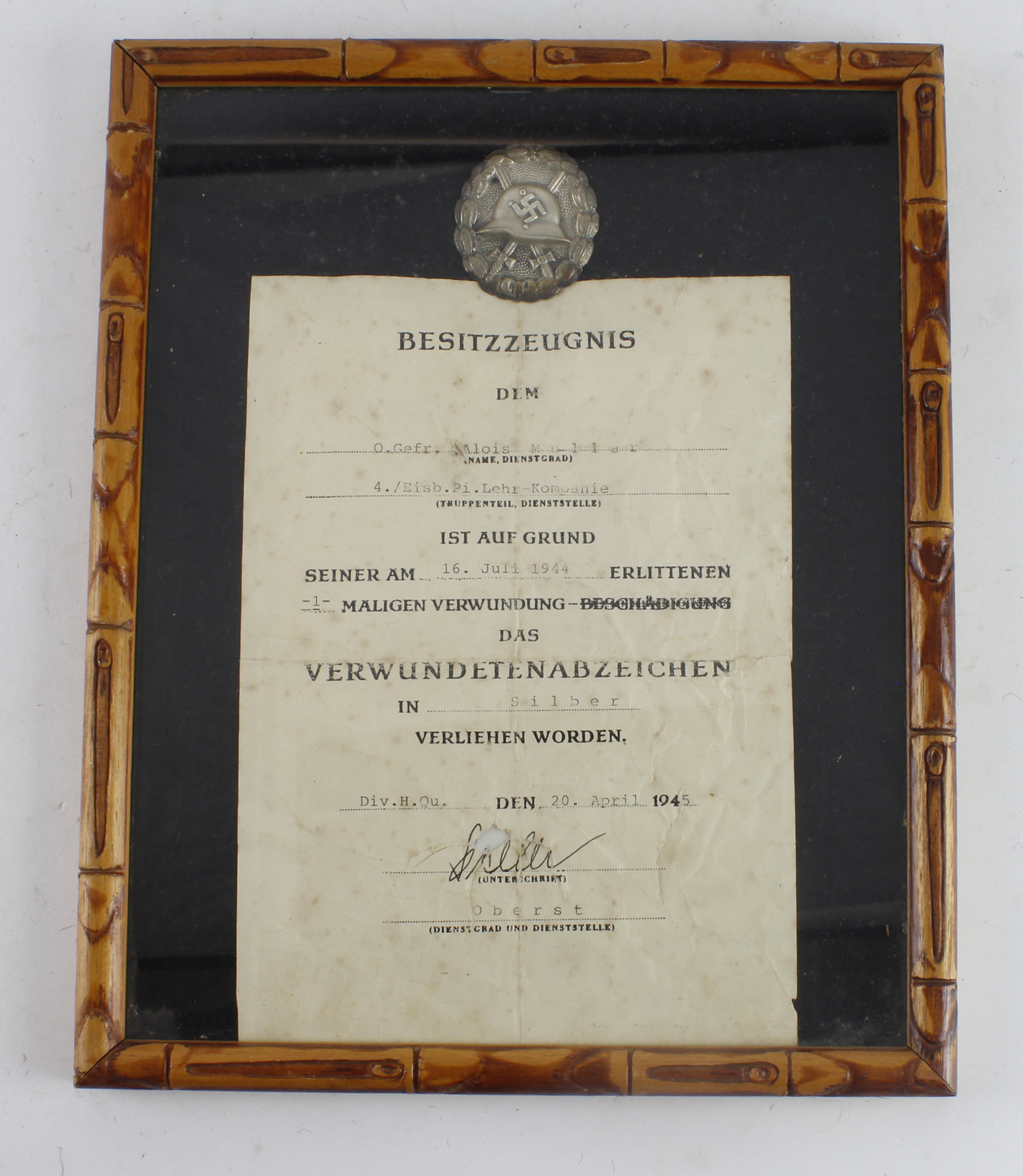 German 3rd Reich Silver Wounds Badge with original award certificate dated 16 July 1944 for 4./
