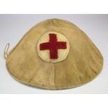 British WW1 Brodie steel helmet complete with liner and chin strap, with a cloth cover tied on, this