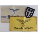 German Luftwaffe Flak helper items, 2x armbands and a female helpers badge.