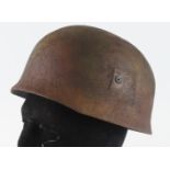 German Paratrooper steel helmet. Rough camo finish. Complete with liner & chin strap.