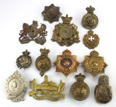 Badges collection of thirteen large badges for Shakos, Pith helmets, pouches etc., including