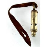 WW1 1917 dated military marked trench whistle made by J Hudson of Birmingham with leather lanyard.
