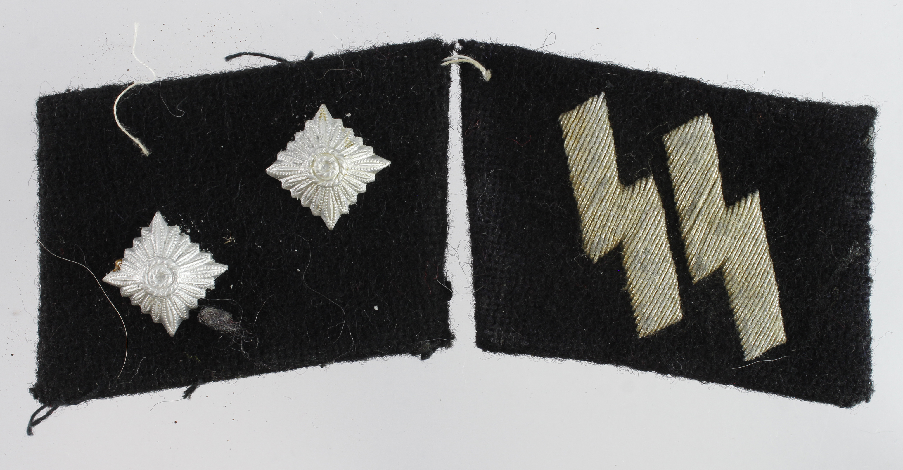 German SS OBERSCHARFUHRER pair of collar tabs one with manufactures paper label on the back.
