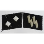 German SS OBERSCHARFUHRER pair of collar tabs one with manufactures paper label on the back.