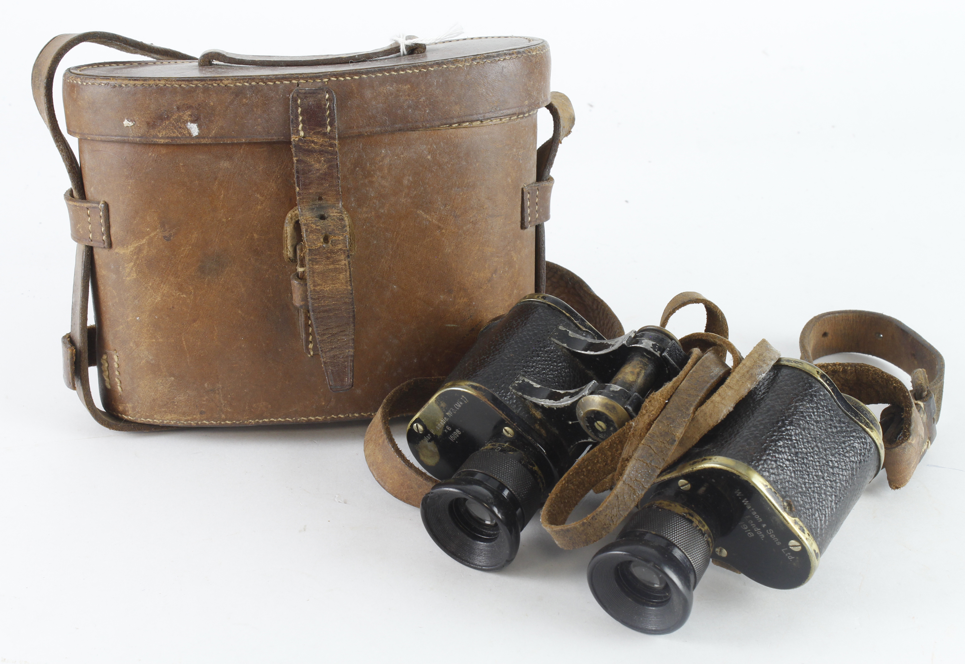 WW1 pair of 1916 dated binoculars made by W Watson of London in their brown leather case.