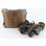 WW1 pair of 1916 dated binoculars made by W Watson of London in their brown leather case.