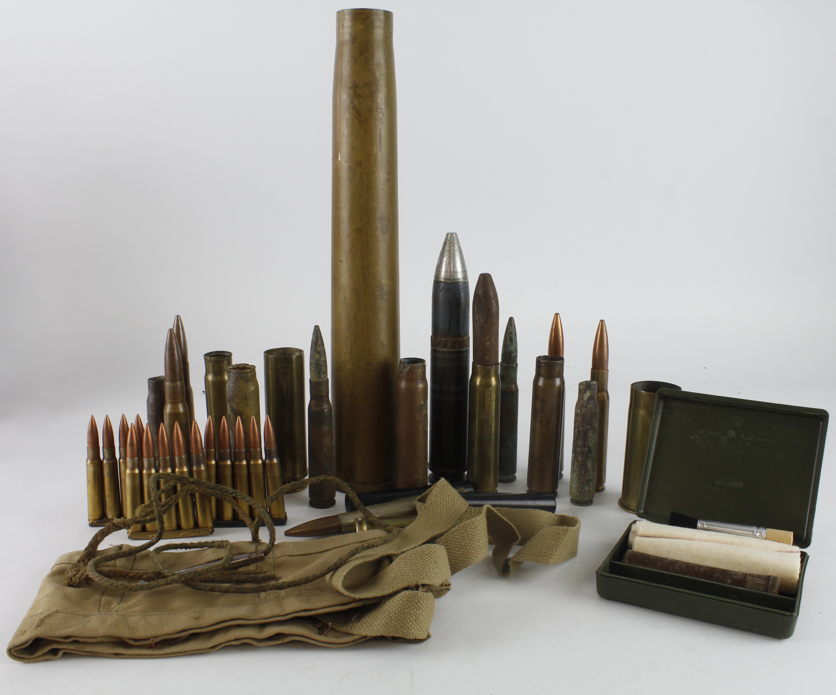 Box of Militaria including Inert ammunition eg Cannon shells / Rifle cartridge clips, canvas