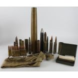 Box of Militaria including Inert ammunition eg Cannon shells / Rifle cartridge clips, canvas