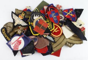Cloth Badges: British Army WW2 and later formation signs, shoulder titles, and rank badges, all in