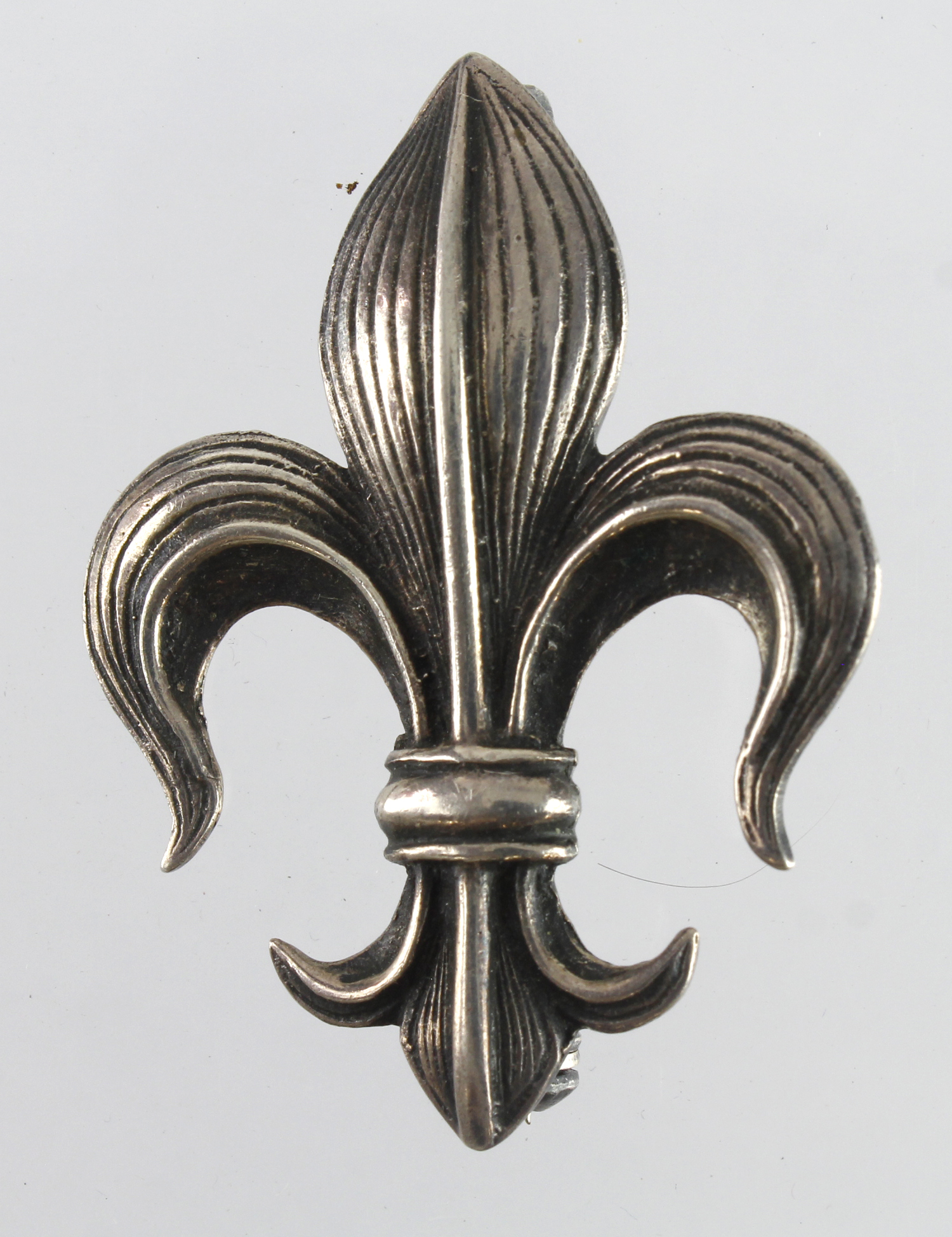 Manchester Regt. (prob.) Officer's silver badge, pin fitting in working order, marked on back "