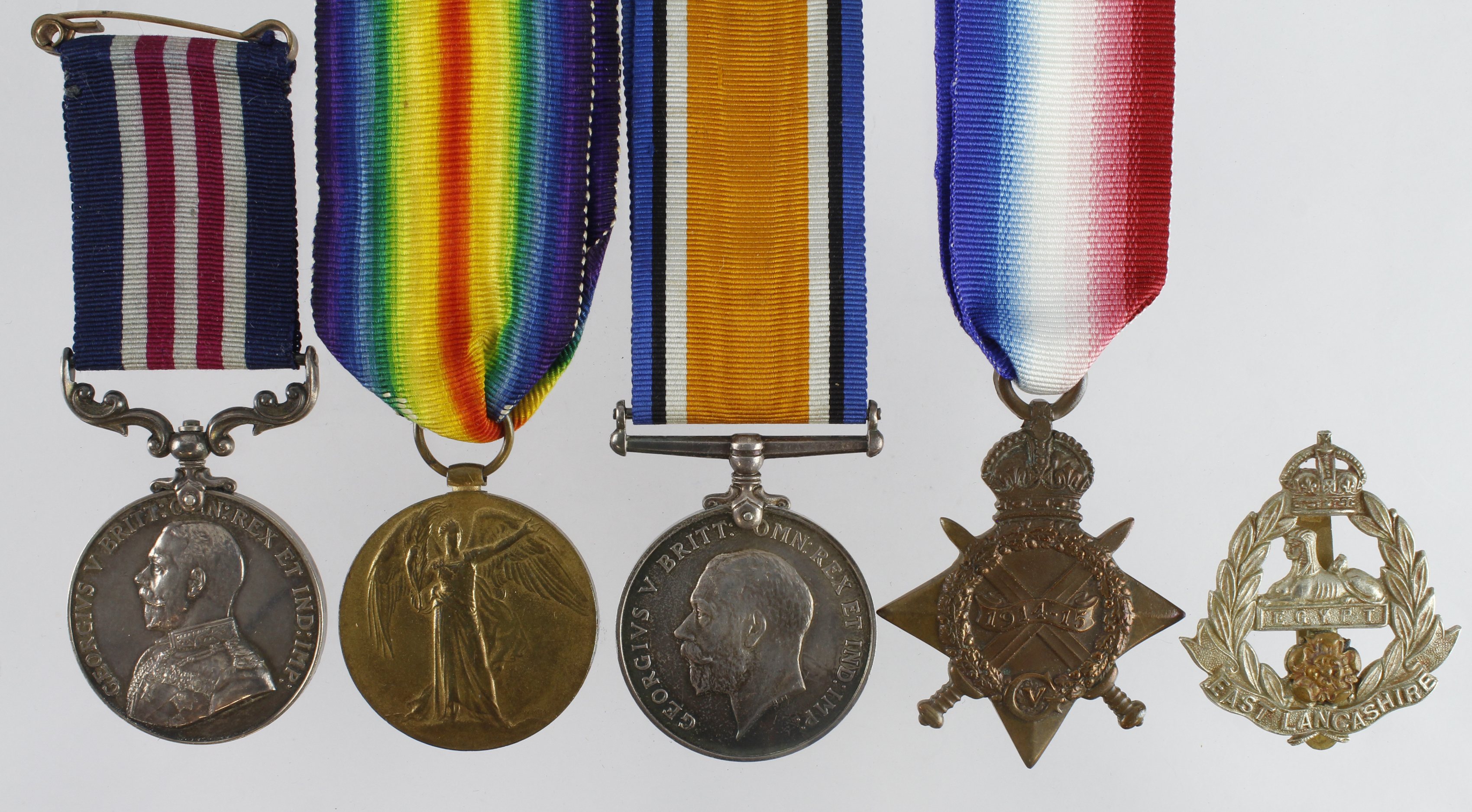 Military Medal GV and 1915 Star (erased), BWM & Victory Medal for 13077 Pte W Whittaker 1st Bn E.