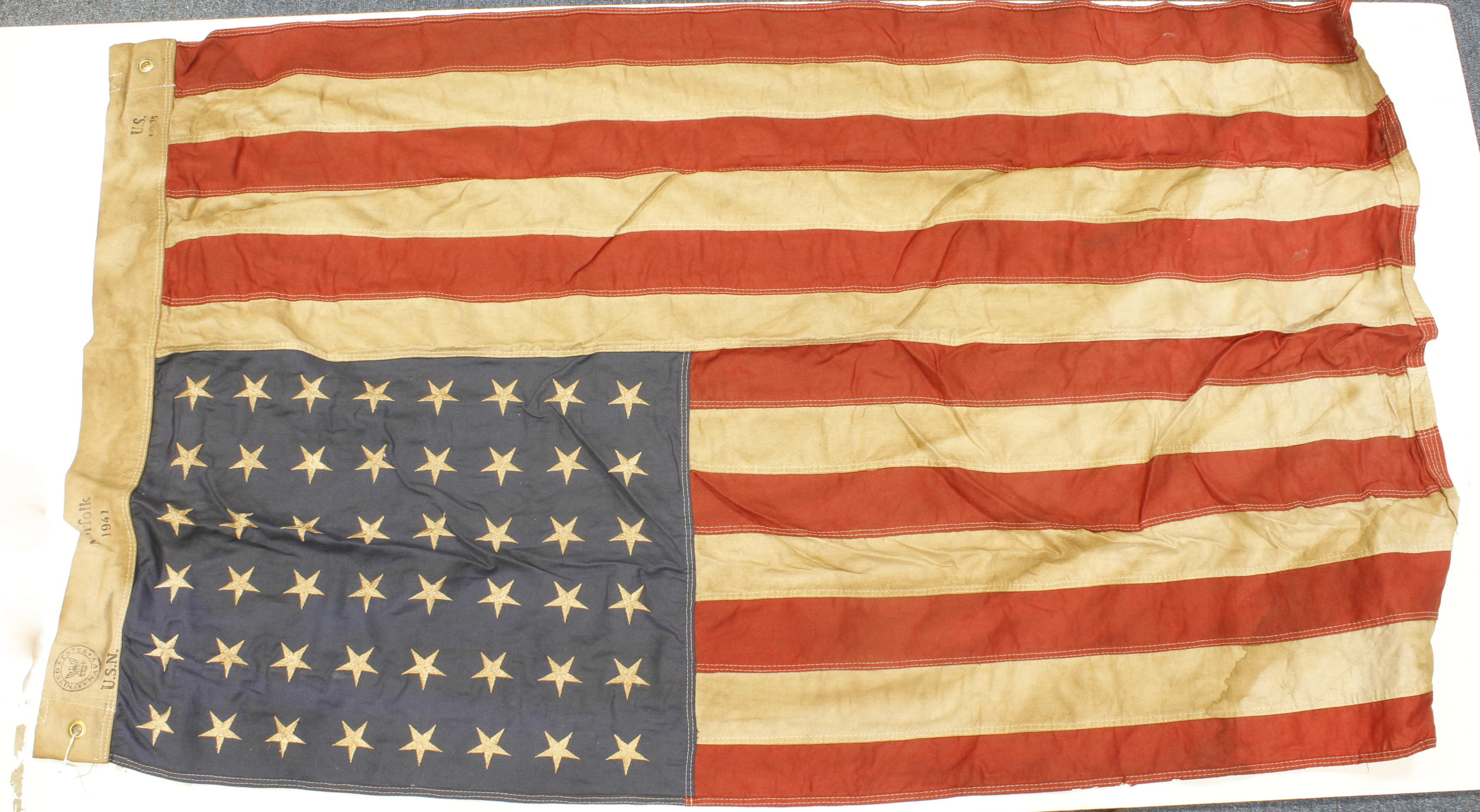 American WW2 flag, large size, issue stamped to US Navy 1941, service wear.