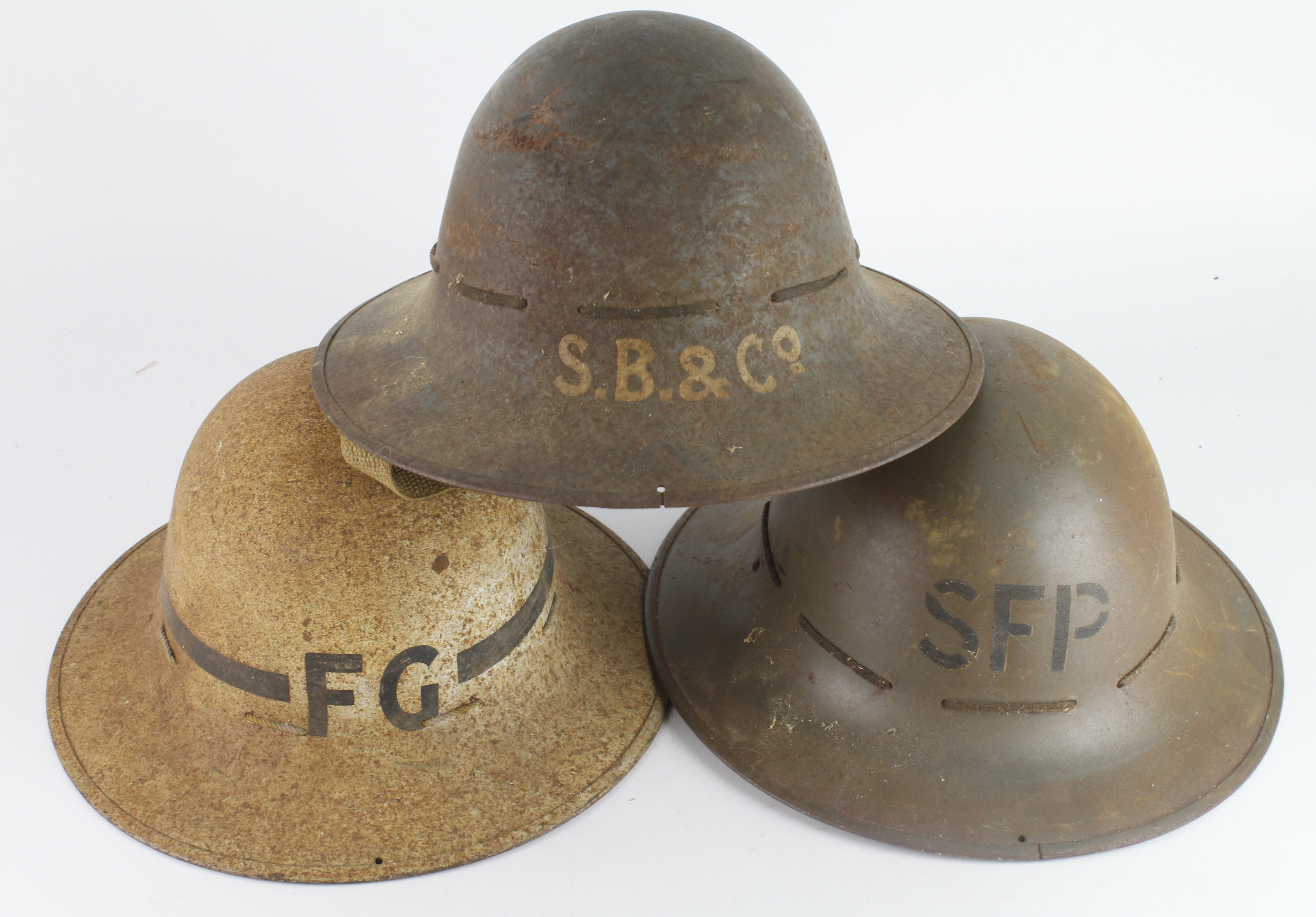 WW2 Fire watches helmets collection of three complete with liners stencilled on the front S.B &