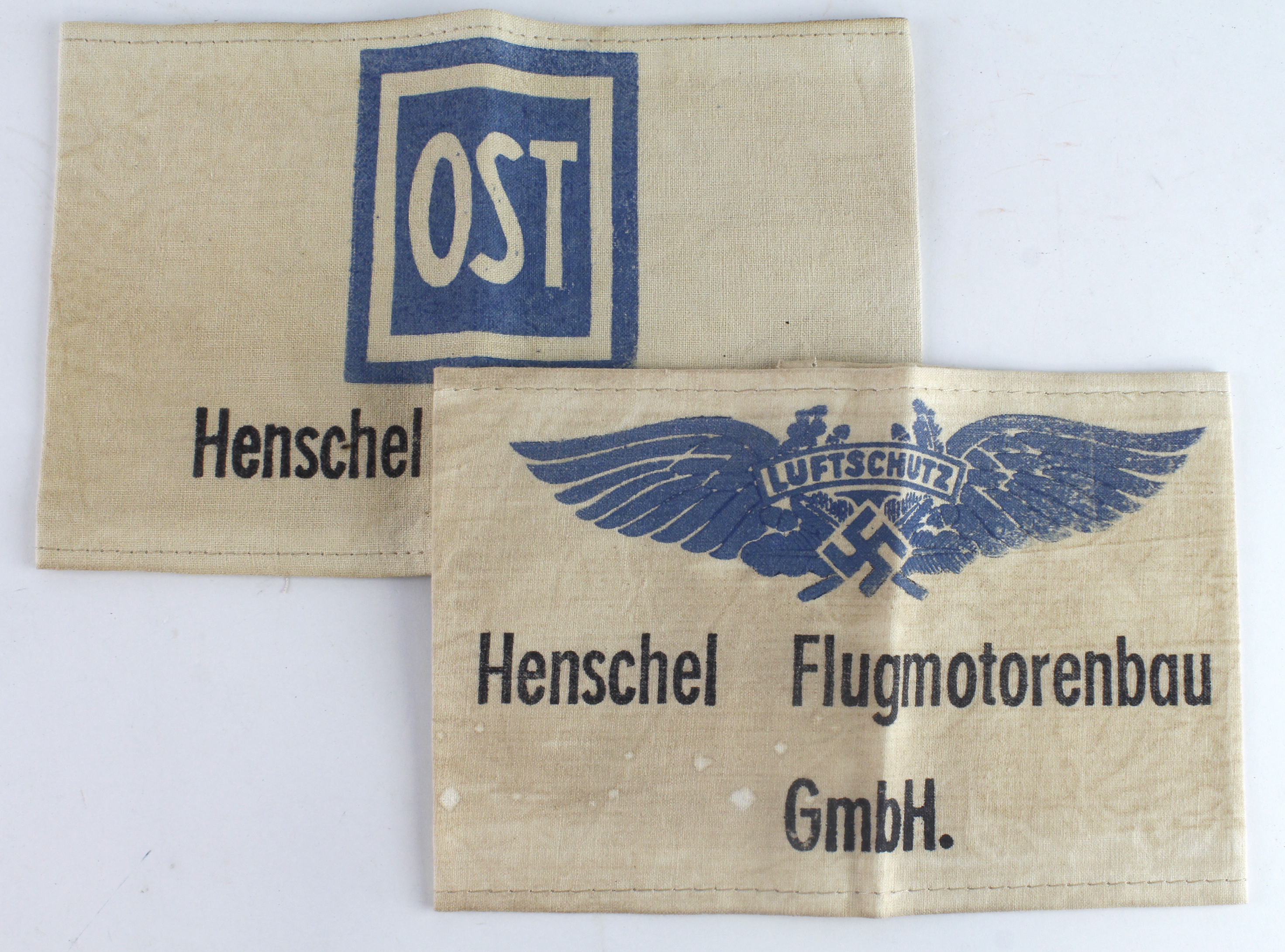 German armbands 2 different for the Henschel Flugmotoren works, one an Ost worker.