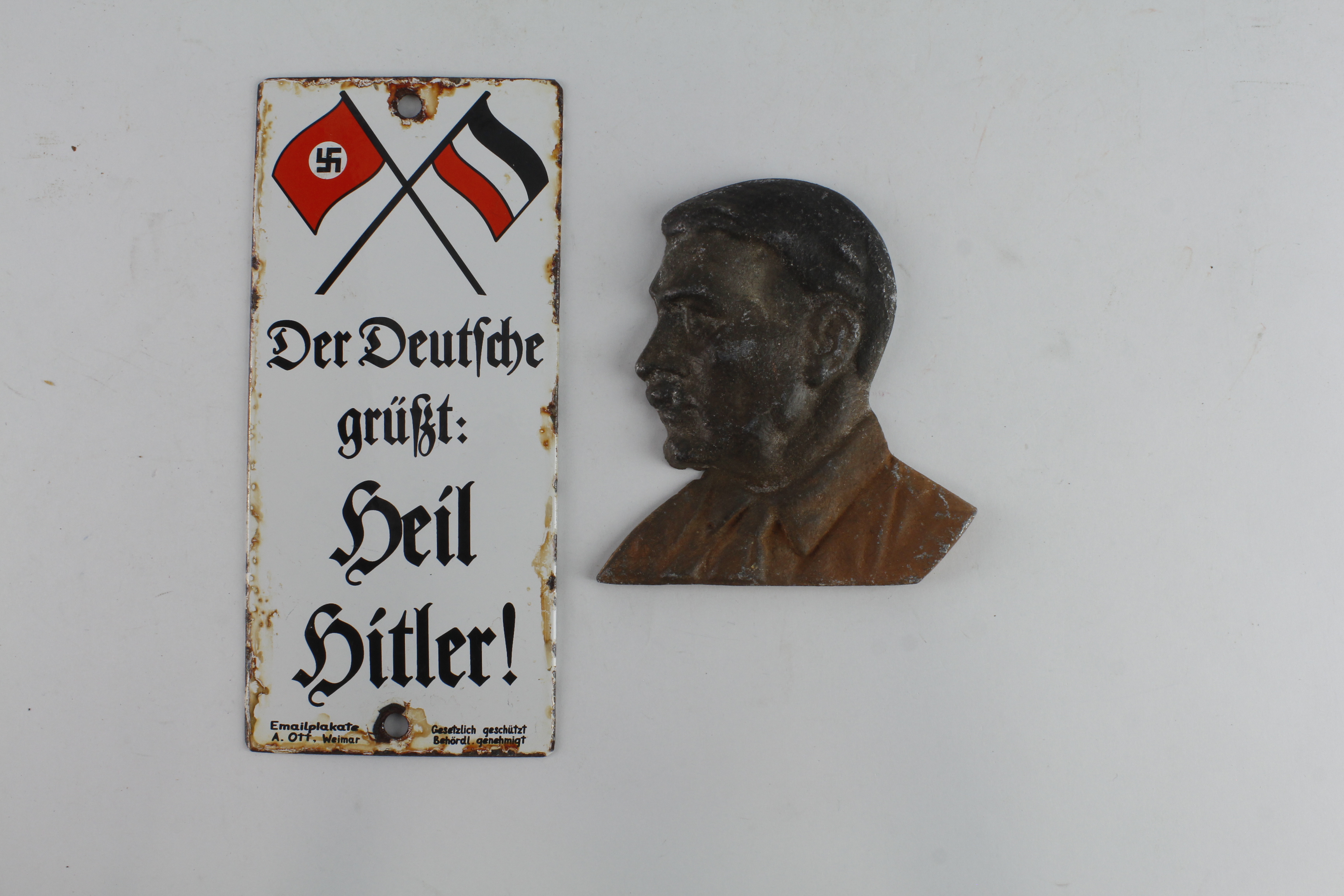 German Hitler interest, an enamel wall plaque and alloy head and shoulders bust of Hitler.