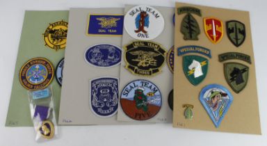 America a Purple Heart together with a selection of USA Seal Team and scarce special patches / cloth