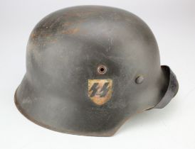 German M42 raw edge Combat helmet, single SS decal, ET64, 2407 number on rear skirt, complete with