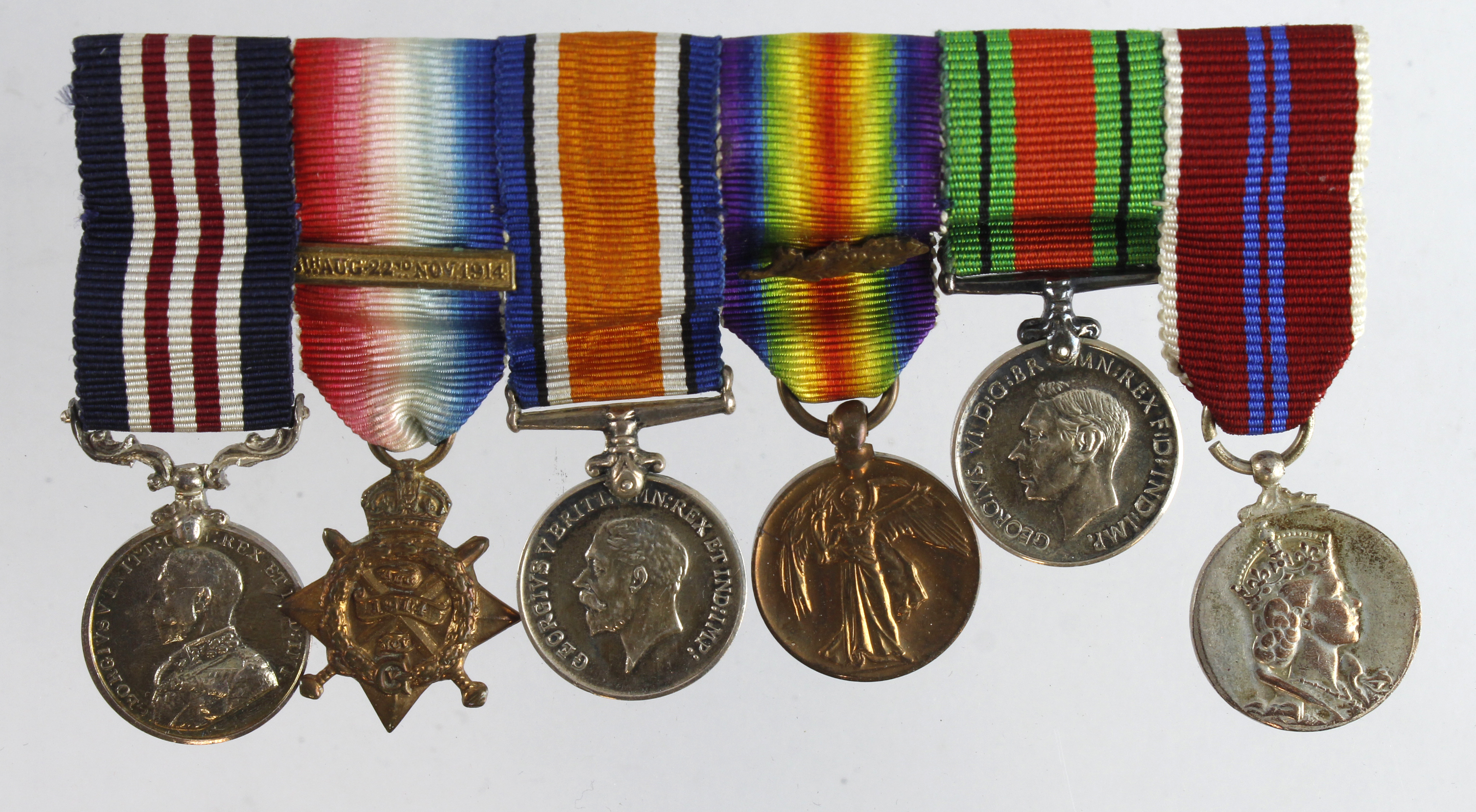 Minature Medal group mounted as worn - Military Medal GV, 1914 Star Trio with clasp and MID, Defence