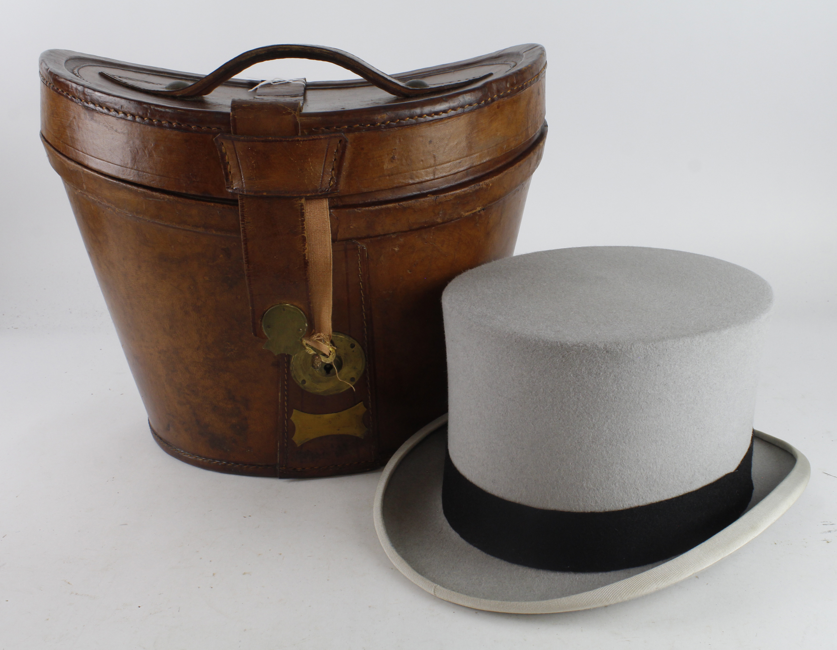 Top Hat. A grey top hat by Woodrow, Piccadilly, contained in contemporary leather hat box, head size