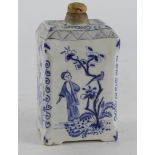 Delft. A Delft bottle / tea caddy, with figural decoration, circa 18th Century (?), height 12.5cm