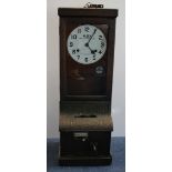 Time Clock. Blick Recording Co. oak cased clocking on machine, height 98cm, width 34cm, 29cm approx.