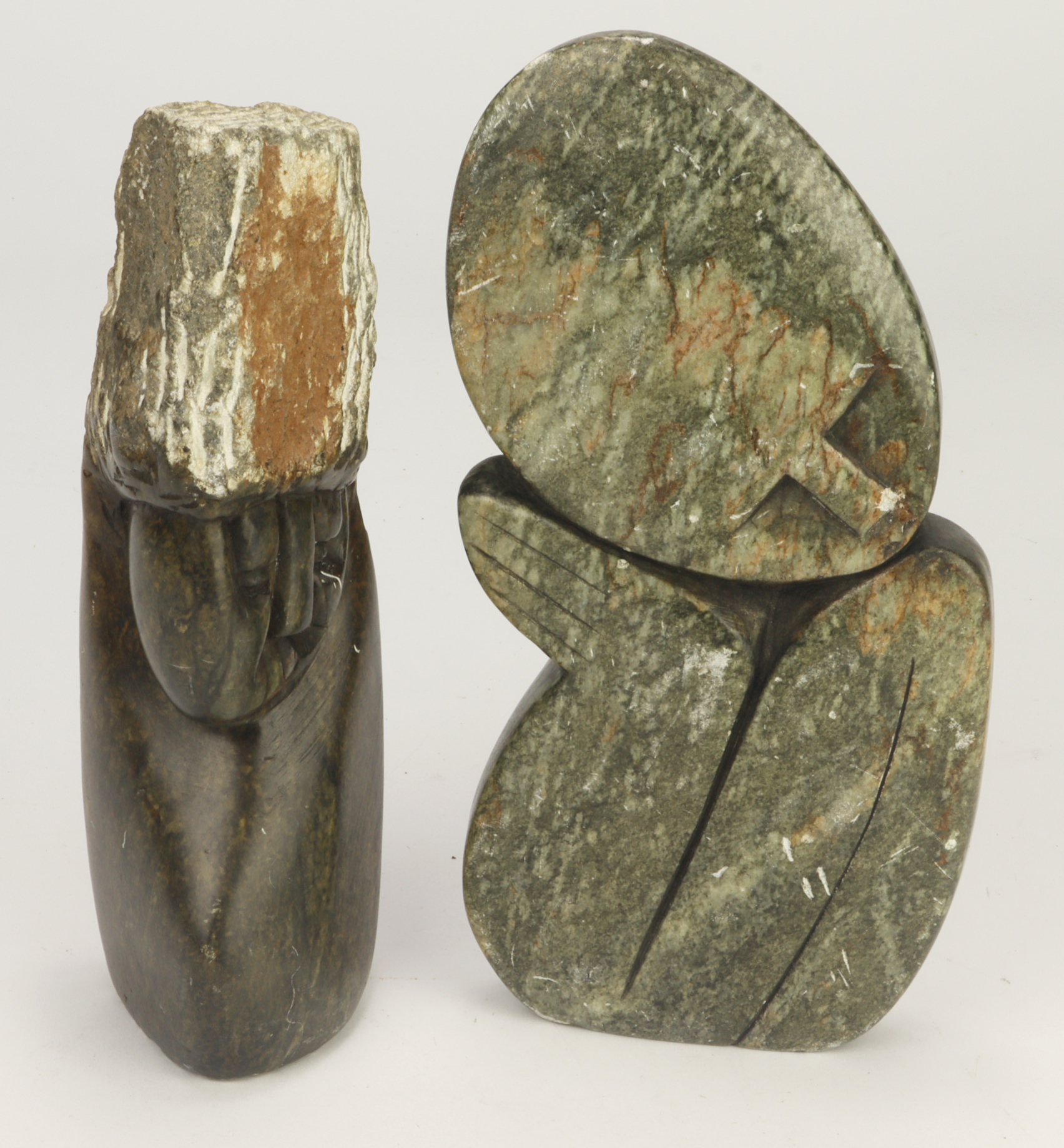 Pair of Shona stone (Zimbabwe) carved figurines. Height approx 19cm and 18cm.